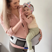 SnuggleSeat™ - Deine entlastende Baby-Tragelösung